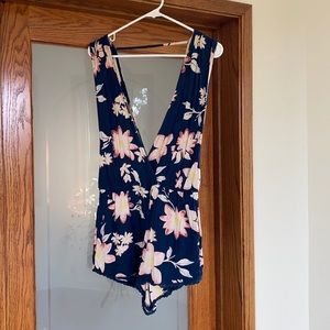 Navy blue romper with flower detail